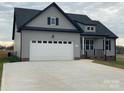 Charming gray two-story home featuring a spacious two-car garage and landscaped front yard at 208 Beths Ct # 35, York, SC 29745