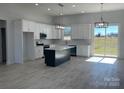 Modern kitchen with white cabinets, large island, and stainless steel appliances at 208 Beths Ct # 35, York, SC 29745