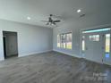 Bright living room with gray walls and vinyl plank floors at 208 Beths Ct # 35, York, SC 29745