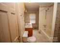 Bathroom with tub, shower, and updated vanity at 2913 & 2901 Wesleyan Church Rd, Lincolnton, NC 28092