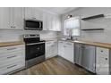 Modern kitchen featuring stainless steel appliances and light wood countertops at 438 Stoneycreek Ln, Rock Hill, SC 29730