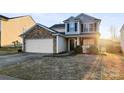 Two-story house with stone accents and a two-car garage at 9321 Bayview Pkwy, Charlotte, NC 28216