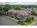 Modern building with parking and city skyline view at 935 Mcalway Rd # 306, Charlotte, NC 28211