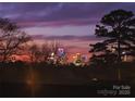 Stunning city skyline view at sunset from a residential property at 935 Mcalway Rd # 306, Charlotte, NC 28211