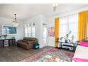 Inviting living room with a chandelier, comfortable seating, and large windows that provide ample natural light at 935 Mcalway Rd # 306, Charlotte, NC 28211
