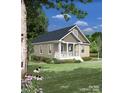 Single-story home with beige siding, a covered porch, and a landscaped yard at 0 Shaver St # 4, Salisbury, NC 28144