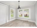 Simple dining area with hardwood floors and view to backyard deck at 123 Lincoln St, Statesville, NC 28677