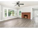 Cozy living room with brick fireplace and hardwood floors at 123 Lincoln St, Statesville, NC 28677