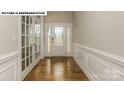 Elegant entryway showcasing hardwood floors and French doors at 193 Asmodean Ln, Troutman, NC 28166