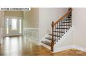 Bright entryway with hardwood floors and elegant staircase at 193 Asmodean Ln, Troutman, NC 28166