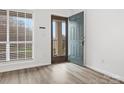 Bright entryway featuring modern flooring, neutral paint, and natural light at 1985 Lancer Ct, Gastonia, NC 28054