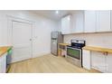 Modern kitchen with stainless steel appliances and butcher block countertops at 212 E Eleventh St, Salisbury, NC 28144