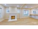 Spacious living room featuring hardwood floors and a fireplace at 212 E Eleventh St, Salisbury, NC 28144