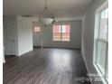 Open living area with hardwood floors, neutral walls, and ample natural light at 285 E Steele St, Salisbury, NC 28144