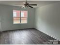 Bright living room with hardwood floors, neutral walls and a ceiling fan at 285 E Steele St, Salisbury, NC 28144