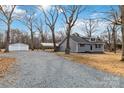 Newly built gray house with detached garage and carport at 307 E Old Highway 74 None, Monroe, NC 28112