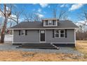 Newly built gray house with black shutters and a yard at 307 E Old Highway 74 None, Monroe, NC 28112