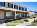 Two-story townhome with stone accents and front porch at 3937 Newhall Dr, Hickory, NC 28601