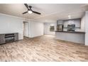 Open living space with wood-look floors and fireplace at 607 Stewart Ct, Statesville, NC 28677