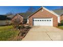 Front view of brick home with a two-car garage at 730 Hidden Creek Cir, Salisbury, NC 28147