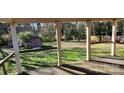View of backyard from covered porch, shed, and fenced yard at 835 Maple Ave, Salisbury, NC 28144
