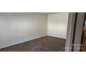 Simple bedroom with carpeted floors and a window at 835 Maple Ave, Salisbury, NC 28144