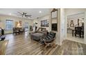 Spacious living room with hardwood floors, fireplace, and ample seating at 1055 Cedar Hills Ln, Lancaster, SC 29720