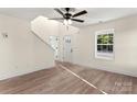 Bright, neutral living room showcasing wood floors, a ceiling fan, and natural light at 1323 Christopher Cir, Rock Hill, SC 29730