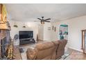 Living room with fireplace, TV, and comfortable seating at 144 Mcmillian Heights Rd, Iron Station, NC 28080