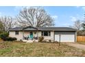 Brick ranch home with gray accents and landscaped yard at 1535 Rolling Meadow Ln, Gastonia, NC 28054