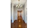 Bright hallway with hardwood floors and chandelier at 207 Lee St, Fort Mill, SC 29715