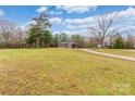 House with large yard, long driveway, and surrounding trees at 2434 Wo Gladden Rd, Chester, SC 29706