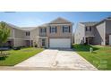 Two-story house with attached garage and landscaping at 1018 Hostler Ln, York, SC 29745
