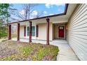 House exterior featuring a red front door and covered porch at 11015 Vista Haven Dr, Charlotte, NC 28226