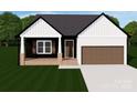 Charming single-story home with a covered porch, a two-car garage, and beautifully manicured lawn at 143 Tranquility Ln, Harmony, NC 28634
