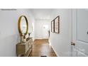 Bright entryway with hardwood floors and decorative console table at 202 Brinkley Dr # 11, Kings Mountain, NC 28086