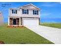 Two-story house with a two-car garage and landscaped lawn at 202 Brinkley Dr # 11, Kings Mountain, NC 28086