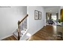 Elegant staircase with dark wood railing and carpeted steps at 202 Brinkley Dr # 11, Kings Mountain, NC 28086