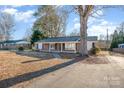 Brick ranch house with a large tree in the front yard at 2617 Fairgreen Dr, Gastonia, NC 28056