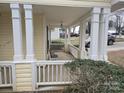 Covered front porch with white columns and railing at 4020 Brandie Glen Rd, Charlotte, NC 28269