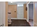 Inviting entryway with tile flooring and staircase at 410 Lakenheath Ln, Matthews, NC 28105