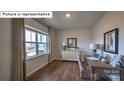 Bright home office features wood floors and built-in cabinetry at 564 Zermatt Ct, Monroe, NC 28112