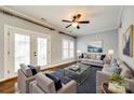 Spacious living room with hardwood floors, comfortable seating, and access to a patio at 634 Atherton Way, Rock Hill, SC 29730