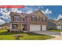 Two-story home with a three-car garage and well-manicured lawn at 8024 Kennesaw Dr, Gastonia, NC 28056