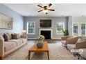 Virtually staged living room with fireplace and neutral decor at 8331 Burgundy Ridge Dr, Harrisburg, NC 28075