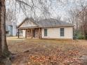 Ranch home with a side view of the house and landscaping at 8820 Rittenhouse Cir, Charlotte, NC 28270