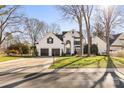 Front view of a two-story house with a two-car garage and manicured lawn at 9103 Cameron Wood Dr, Charlotte, NC 28210