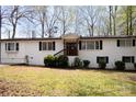 Inviting brick home with a charming entryway and well-maintained landscaping at 1035 Timberlane Dr, Lincolnton, NC 28092