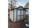 White and gray storage shed in the backyard at 145 Arrowood Trl # 61F, Mount Gilead, NC 27306