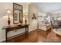 Living room with hardwood floors, a sofa, and a console table at 23008 Whimbrel Cir, Fort Mill, SC 29707